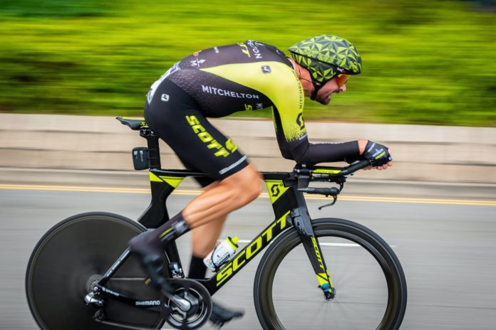 man racing with a bicycle
